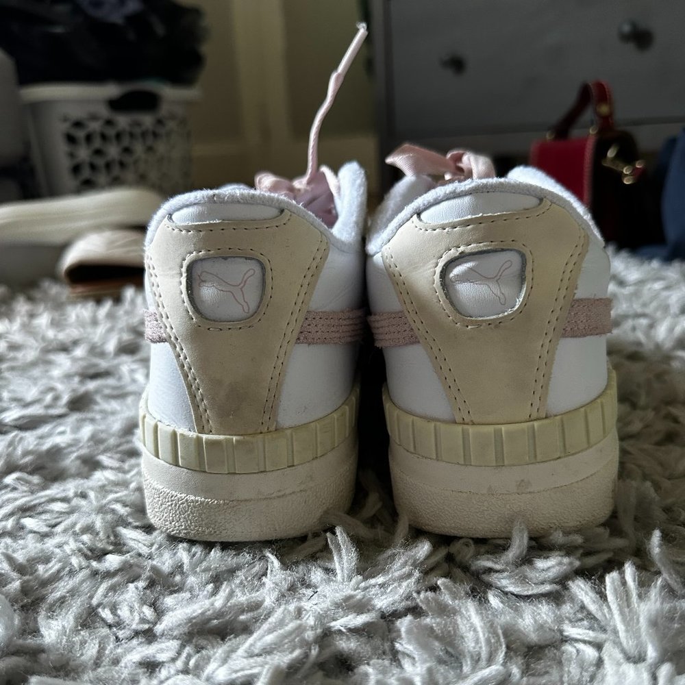 White and pink puma sneakers